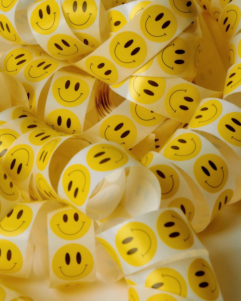 Rows of identical smiley face stickers, what your feed looks like when everyone copies the same Instagram trend